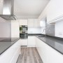 House conversion for rental | Kitchen - black quartz work surface | Interior Designers